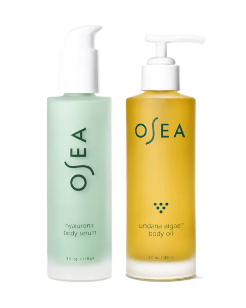 Two OSEA skincare products, a green serum bottle and a yellow body oil bottle, on a white background.