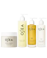 Set of OSEA skincare products including a jar, body wash, oil, and lotion on a white background.