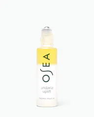 A bottle of OSEA Undaria Uplift fragrance mood oil with a yellow-to-clear gradient label and a clear rollerball cap, centered on a white background.