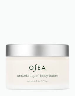 A jar of OSEA Undaria Algae Body Butter with a white label and silver lid.