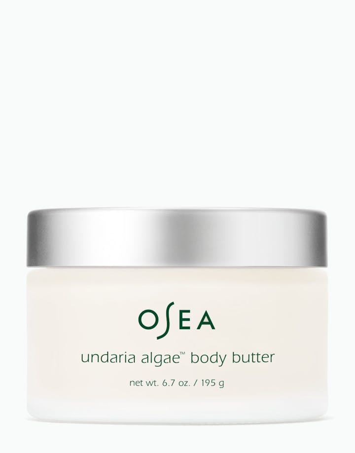 A jar of OSEA Undaria Algae Body Butter with a white label and silver lid.