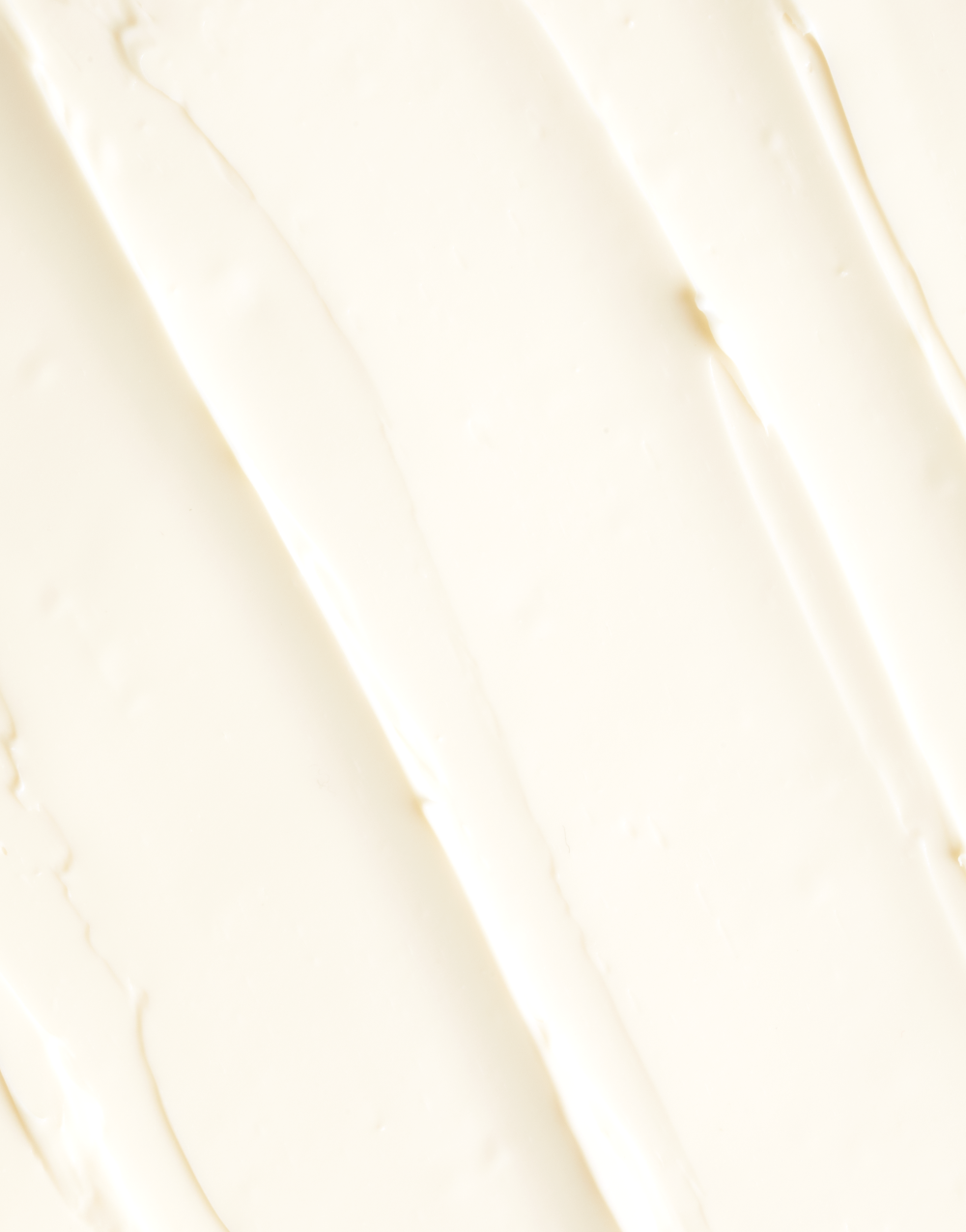 Texture close-up of OSEA Undaria Algae Body Butter swirled on a light surface