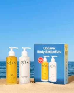 OSEA body care products with a blue sky and ocean background