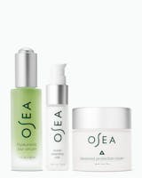 OSEA skincare product set including serum, cleansing milk, and cream on a white background