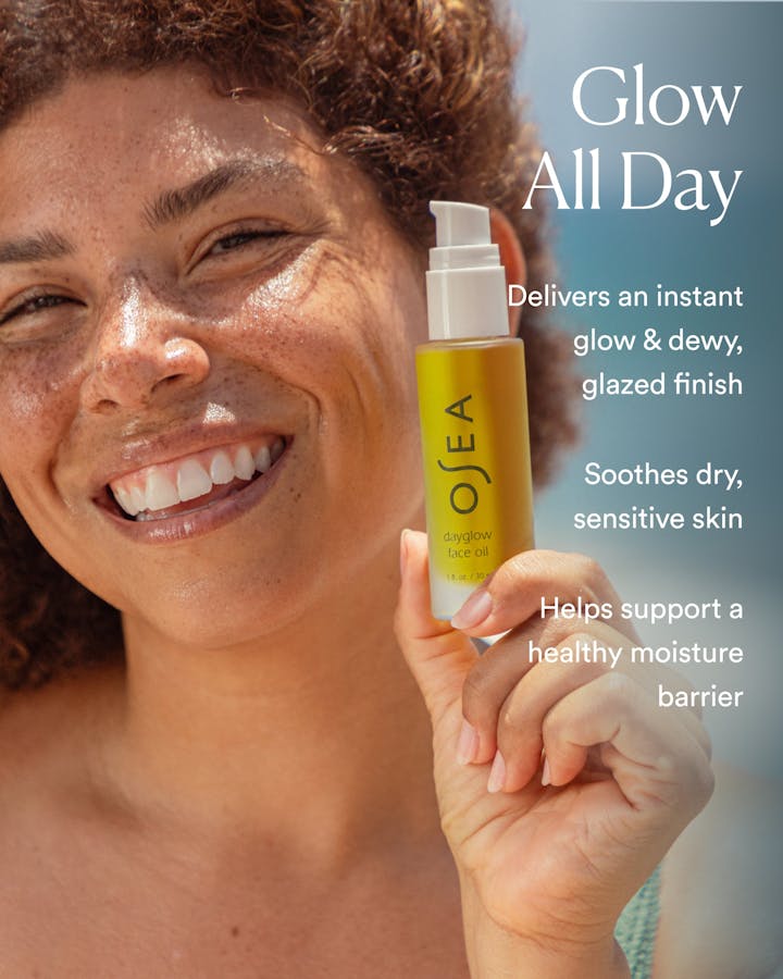 Woman holding a bottle of OSEA skincare product with text about product benefits.