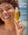 Model holding Dayglow Face Oil with text highlighting instant glow, soothing hydration, and moisture barrier support