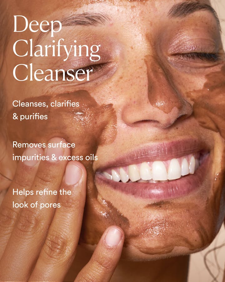 Person applying a deep clarifying cleanser to their face with product description text.
