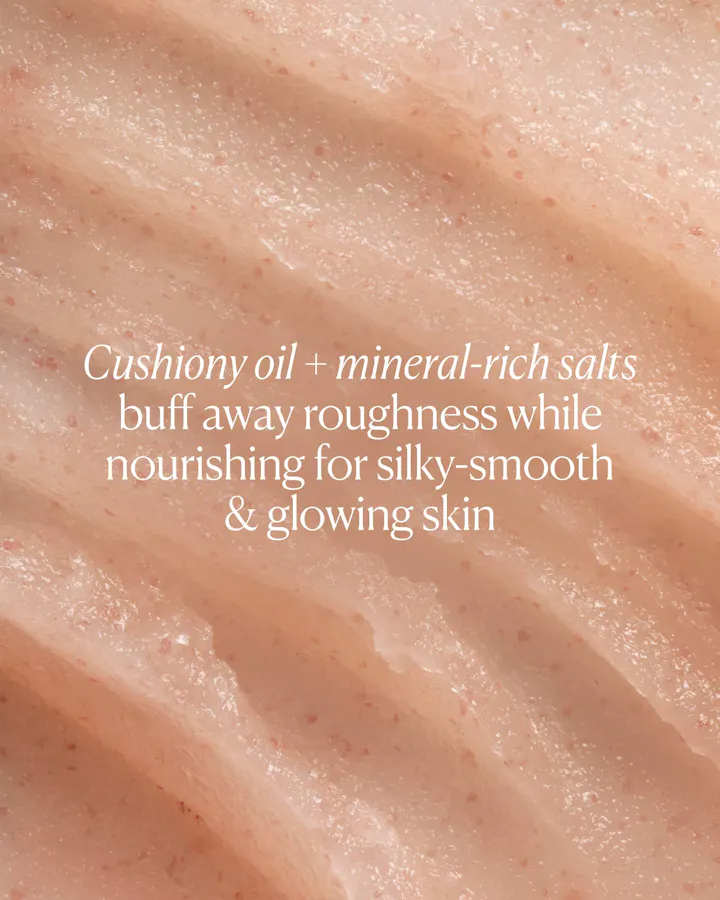 Close-up of a skin texture with text describing cushiony oil and mineral-rich salts for skincare.