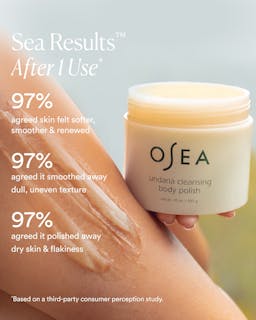 OSEA body polish jar with skin benefits text on a blurred background