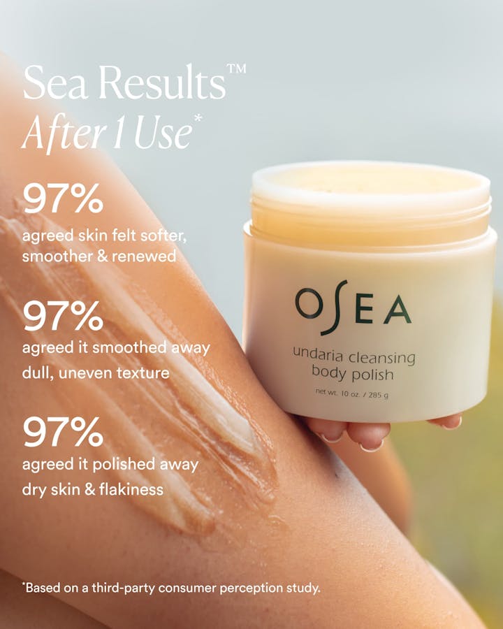 OSEA body polish jar with skin benefits text on a blurred background