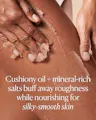 Close-up of hands applying cushiony oil and mineral-rich salts to skin with text describing its benefits.