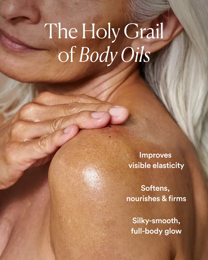 Close-up of a woman's shoulder and upper chest with text reading 'The Holy Grail of Body Oils' and additional claims about improving elasticity, softness, firmness, and a silky smooth glow.