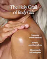 Close-up of a woman's shoulder and upper chest with text reading 'The Holy Grail of Body Oils' and additional claims about improving elasticity, softness, firmness, and a silky smooth glow.