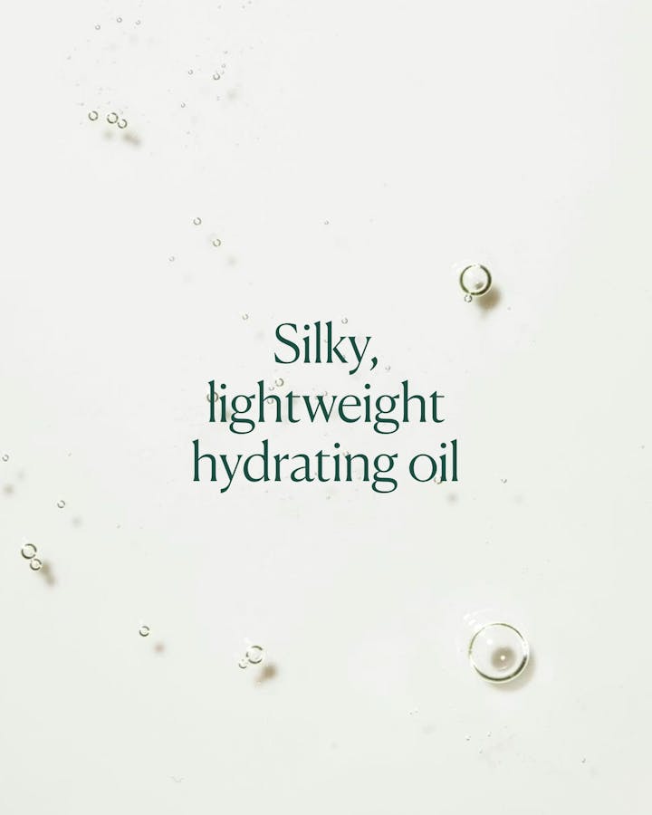 Text 'Silky, lightweight hydrating oil' on a light background with small droplets.