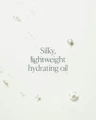 Close-up of silky oil texture with on-image text emphasizing lightweight hydration
