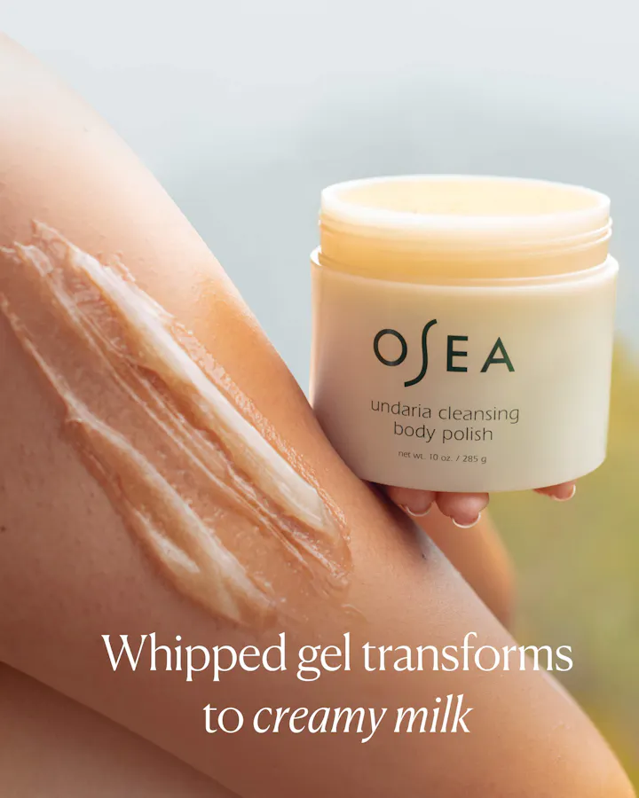 OSEA body polish jar with whipped gel on skin, text 'Whipped gel transforms to creamy milk'.