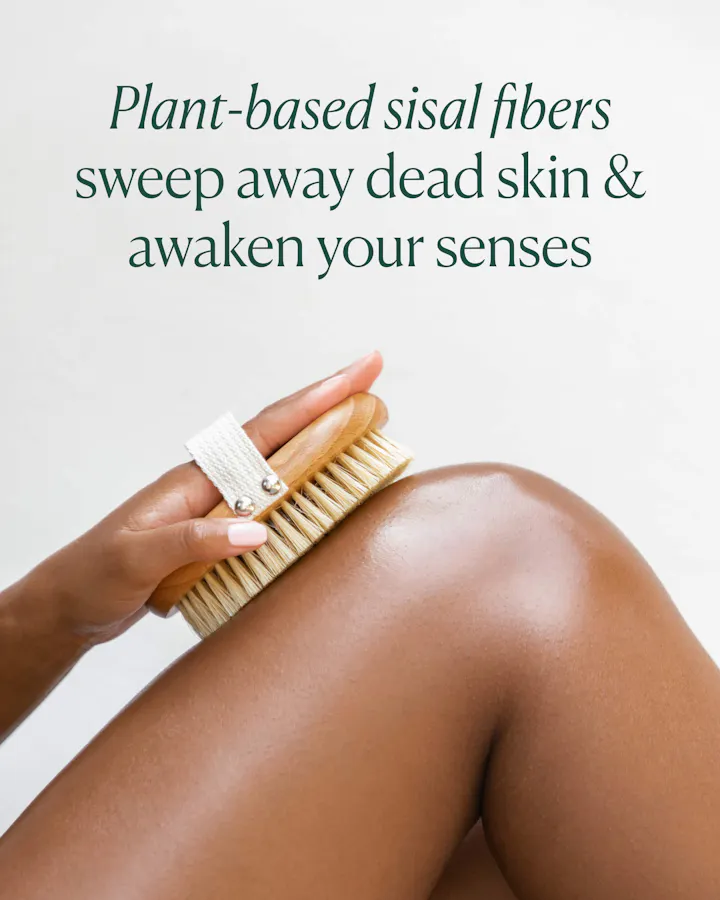 Person using a brush on their leg with text about plant-based sisal fibers.