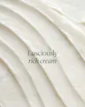 Close-up of luscious cream with text 'Lusciously rich cream' on a white background