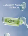 OSEA gel serum bottle with dropper on a blue background