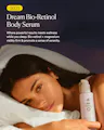 A woman lying in bed at night holds a bottle of OJEA Dream Bio-Retinol Body Serum. The image features a dark navy blue background with white text describing the product benefits, and a yellow '2025' badge in the top left corner.
