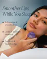A woman lying down and holding an open jar of OSEA Dream Lip Mask near her face, with glossy lips, and text reading 'Smoother Lips While You Sleep: Softens lips & smooths lines. Locks in essential moisture. Comforts & nourishes lips.'