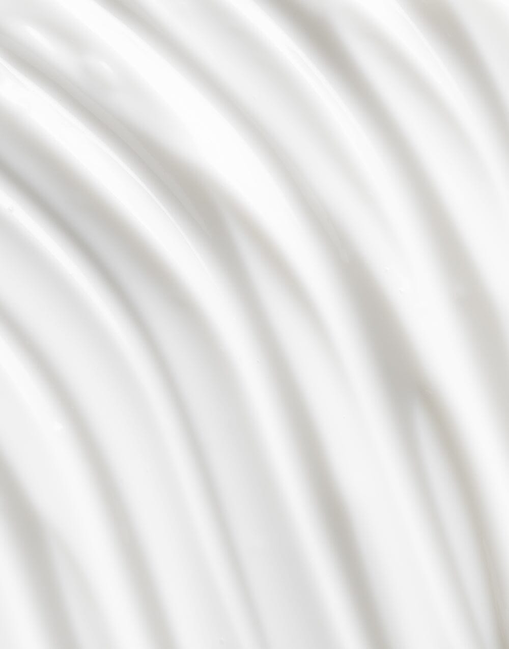 Creamy swirl texture of OSEA Advanced Protection Cream with glossy ridges