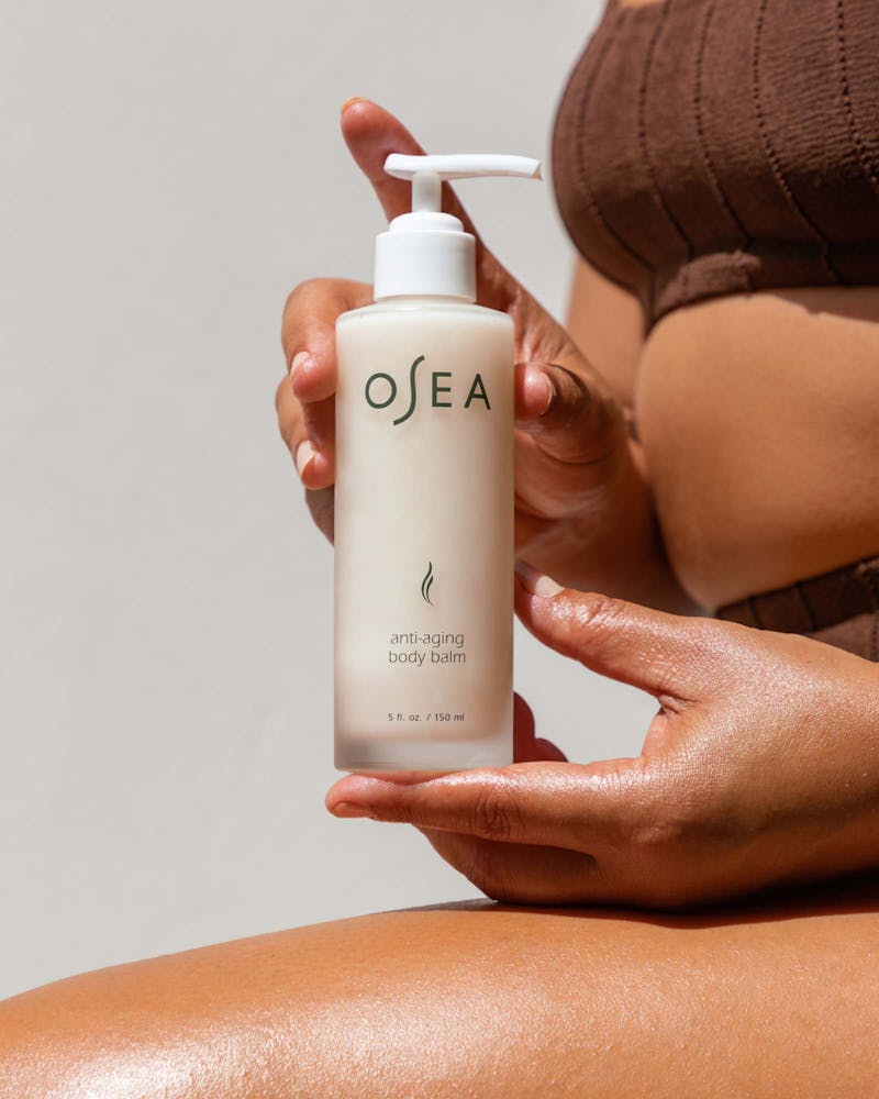 A pump bottle of OSEA anti-aging body balm.