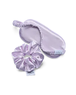 OSEA lavender satin sleep mask and matching scrunchie set on white background for ecommerce display