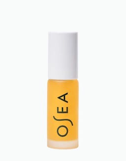 Yellow bottle with white cap on a white background
