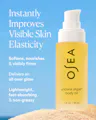 OSEA undaria algae body oil bottle with text on a blue background