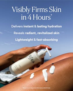 Person applying sunscreen to their arm with a blue sky background