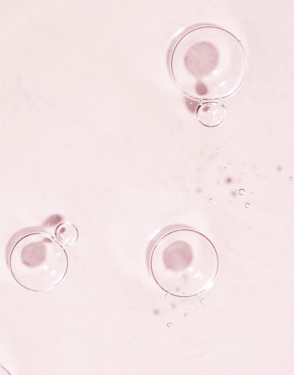 Hand holding Ocean Eyes Eye Serum against blue sky background