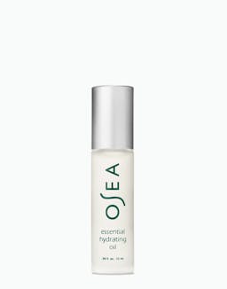 Essential Hydrating Oil rollerball bottle on white surface