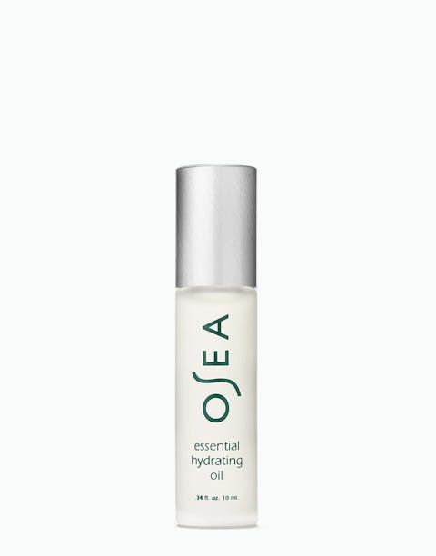 Essential Hydrating Oil rollerball bottle on white surface