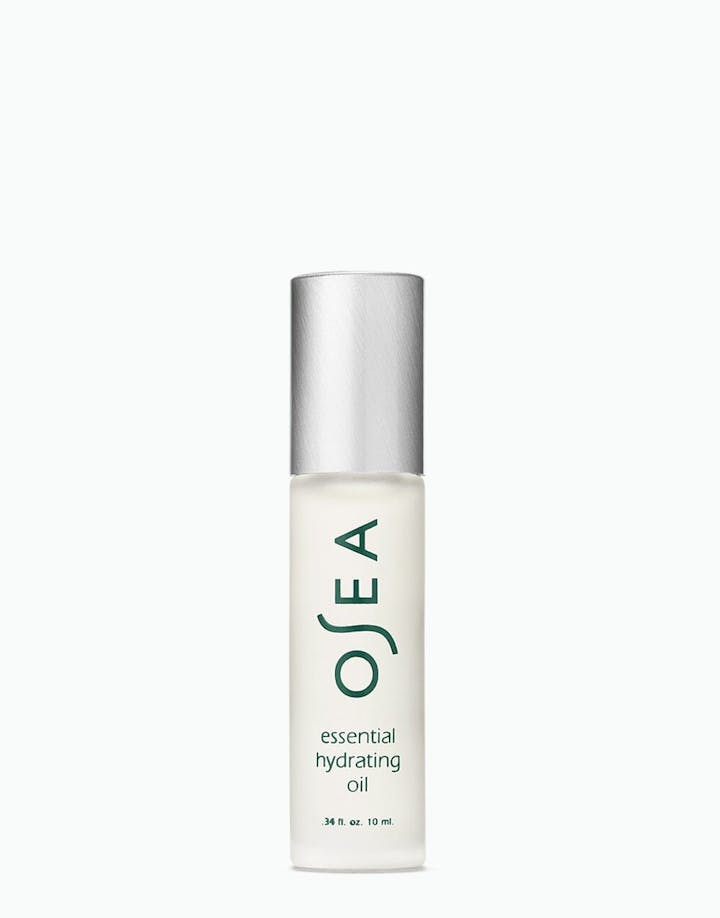 Essential Hydrating Oil rollerball bottle on white surface