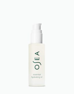 A pump bottle of OSEA essential hydrating oil on a white background.