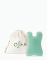 OSEA sculpting tool displayed next to branded drawstring pouch