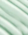 Close-up of mint-green Hyaluronic Body Serum texture swatch