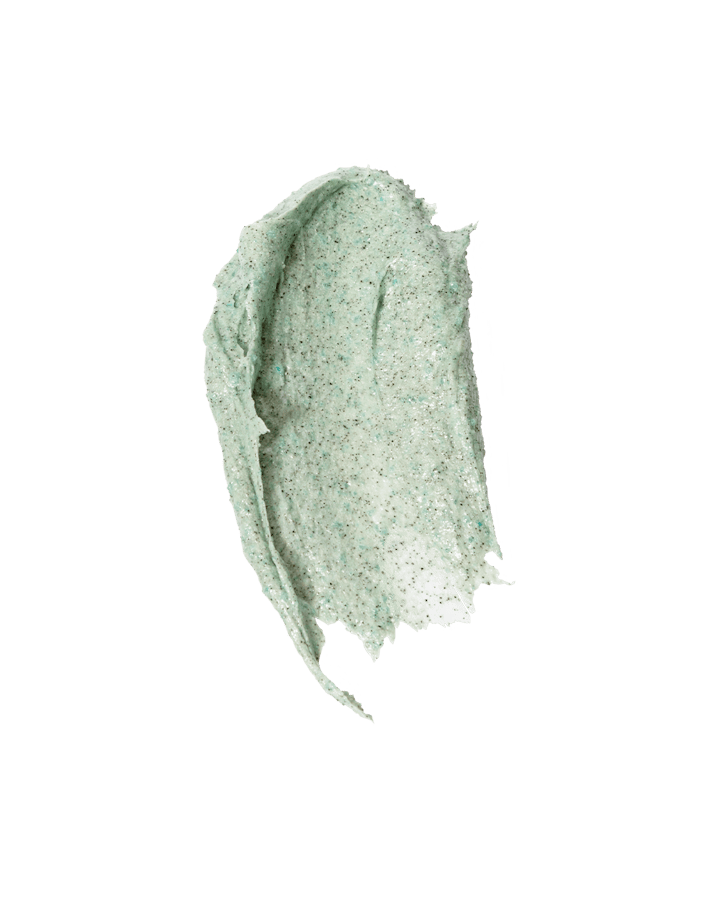 Green swatch of OSEA Seaglow Scrub with creamy, grainy texture on white background