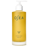A clear pump bottle with yellow liquid labeled OSEA undaria algae body oil.