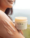 Undaria Cleansing Body Polish applied to shoulder to show exfoliating, gel-to-milk texture