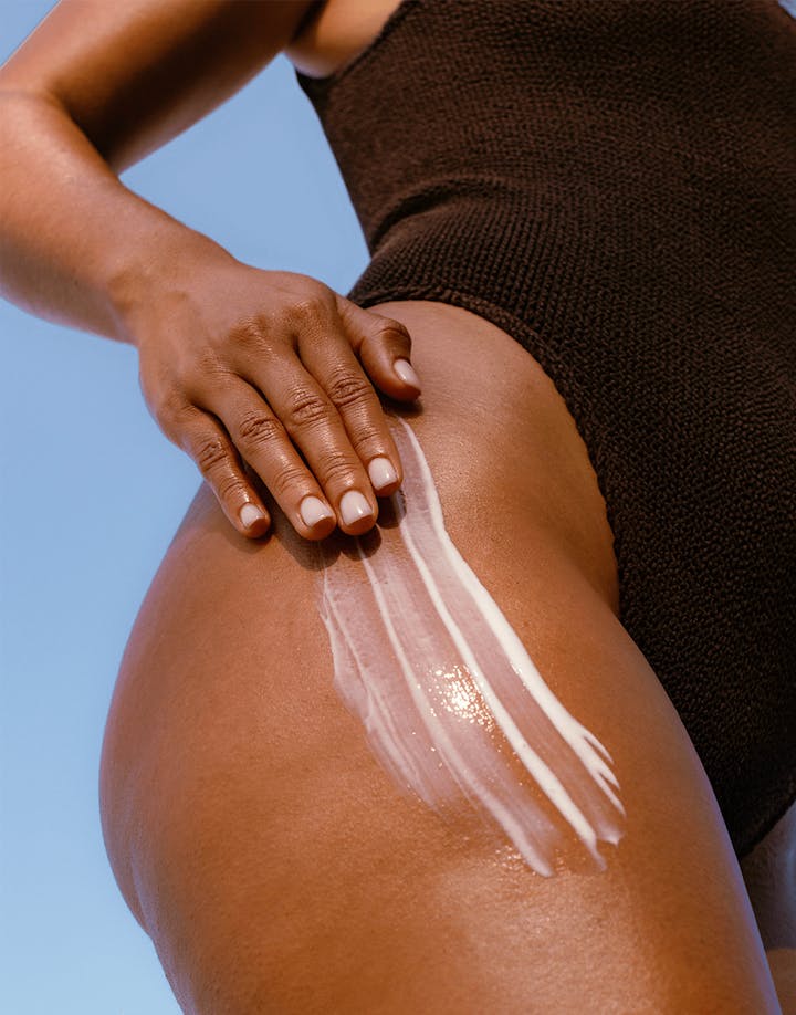 Undaria Algae™ Body Lotion being smoothed onto skin, highlighting lightweight hydration and silky texture