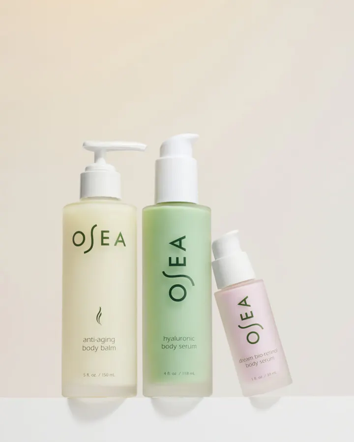 Three OSEA skincare products on a light beige background