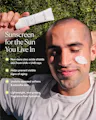 Man applying sunscreen with text about its benefits on a grassy background