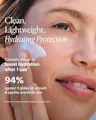Woman applying cream to her face with text about product benefits