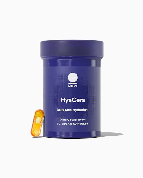 Blue container of HyaCera dietary supplement with a capsule on a white background