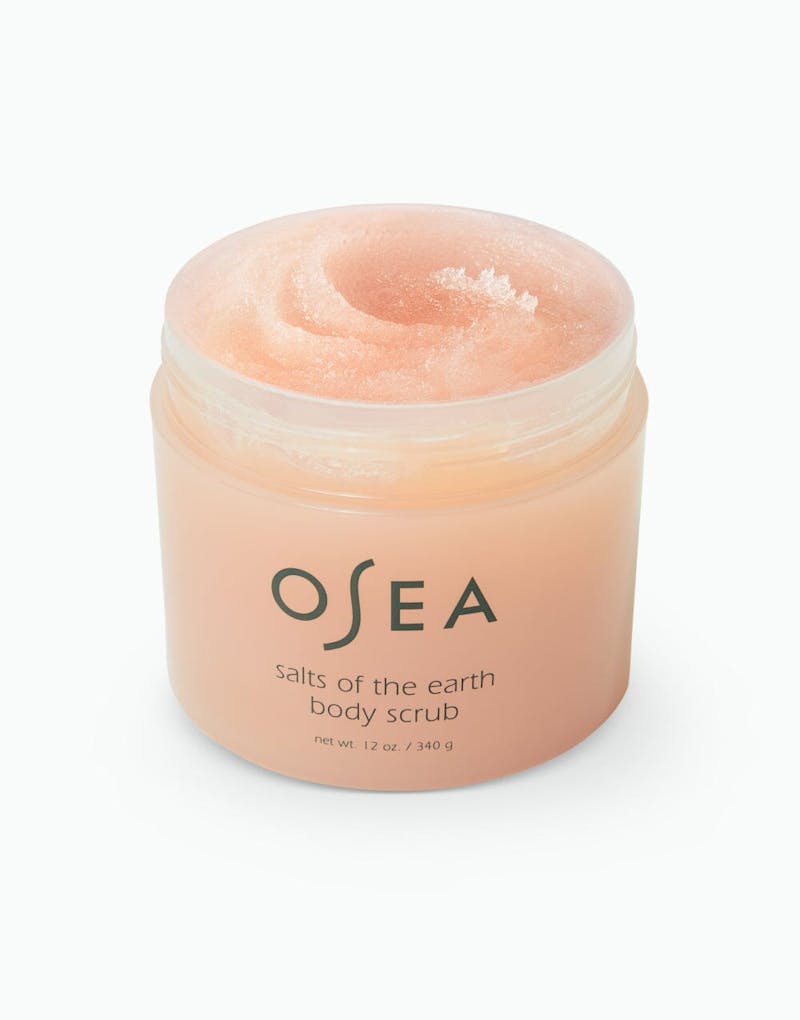 Opened jar of OSEA Salts of the Earth Body Scrub showing peach-toned, whipped exfoliating formula