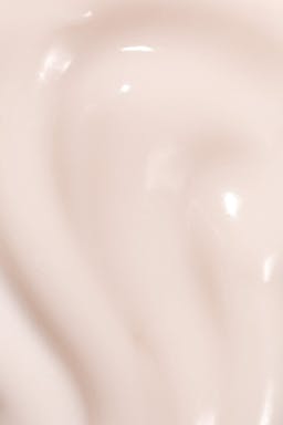 Swatch of Seaglow Overnight Serum showing smooth, glossy pale pink texture