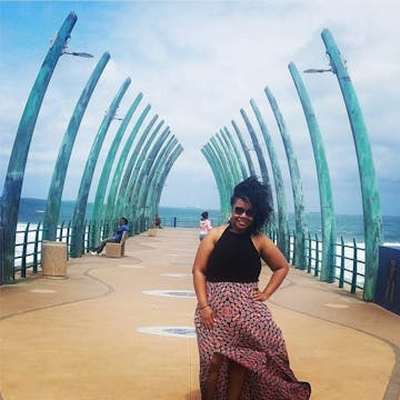 Person Posing For A Photo On The Pier