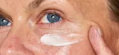 Woman Using an Eye Cream On Her Face